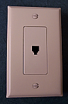 Wall socket cable outlet for telephone connector and almond finish