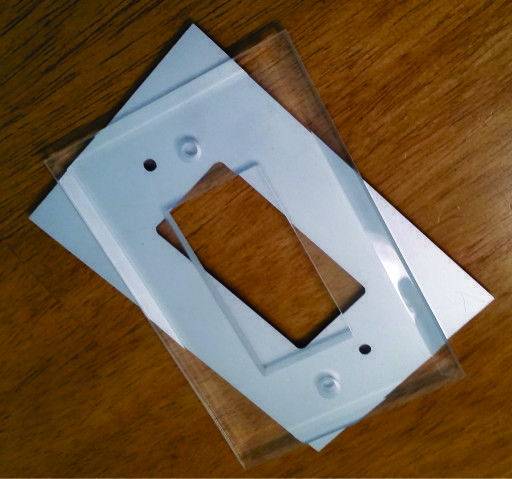 clear and painted comparison_glass switch plate