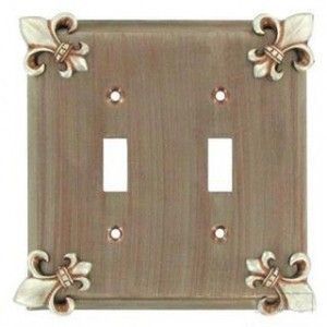 Fleur De Lis Design Double Switch Wallplate shown in Pewter with a Cherry Wash